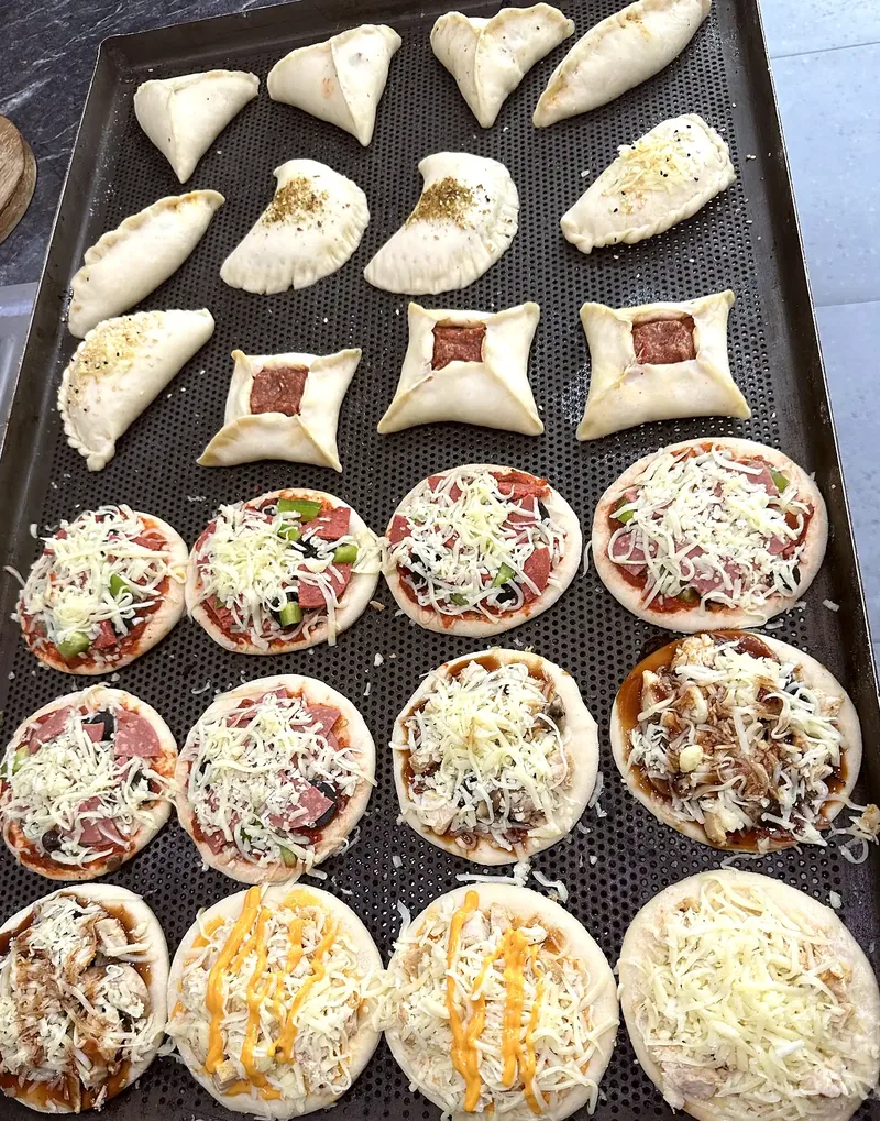 A tray of manoush and fatayer ready for the oven